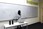  WEST 2017 A student writing conversation topics on a whiteboard